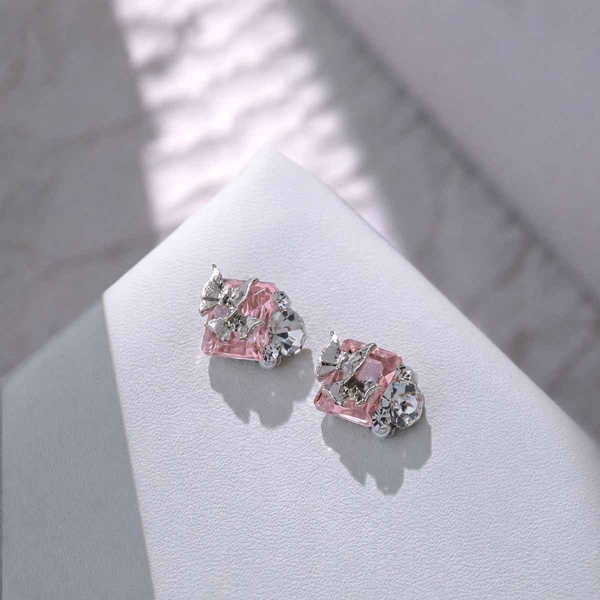 Pink rectangular butterfly nail charms with silver accent details