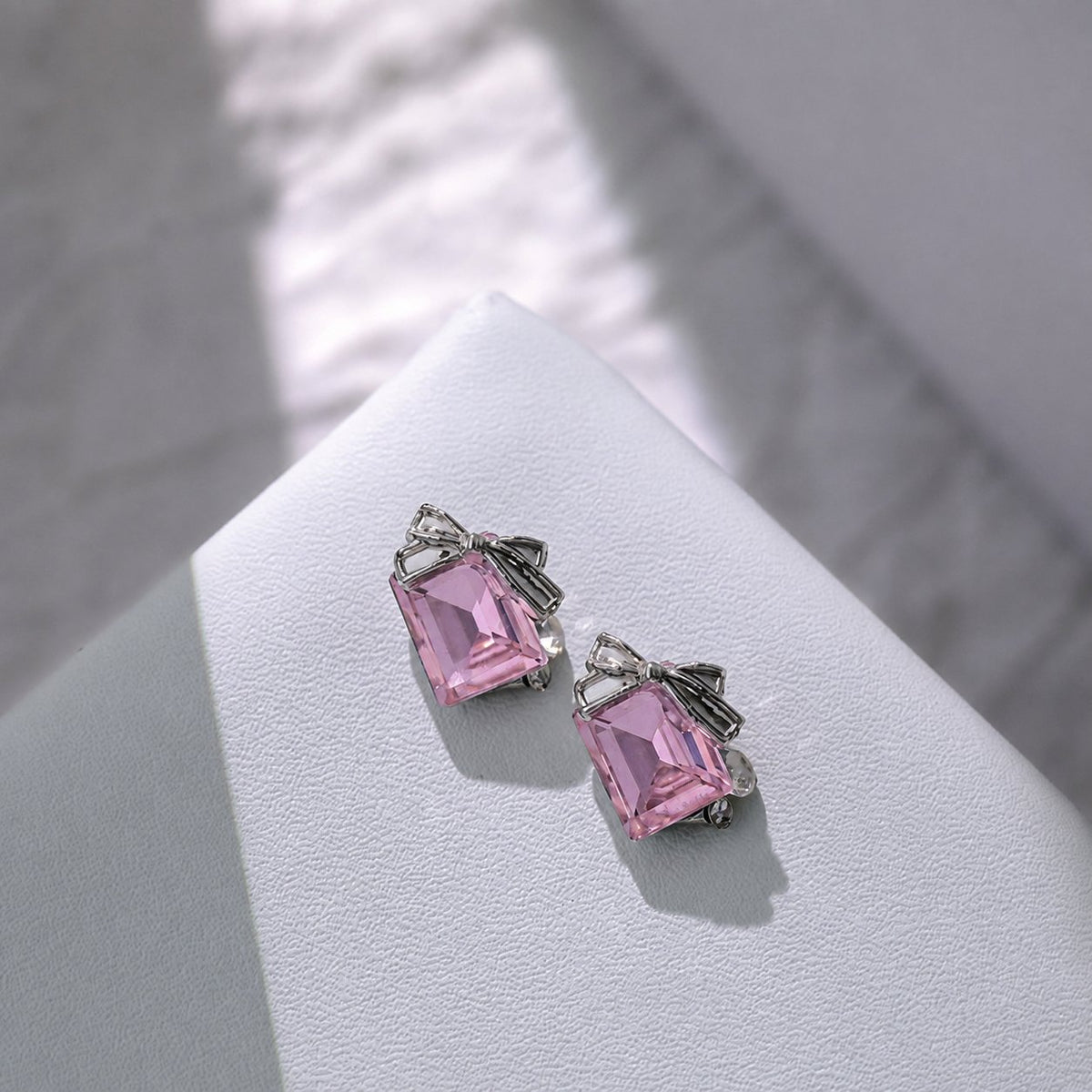 Pink rectangular bow nail charms with pearl accents