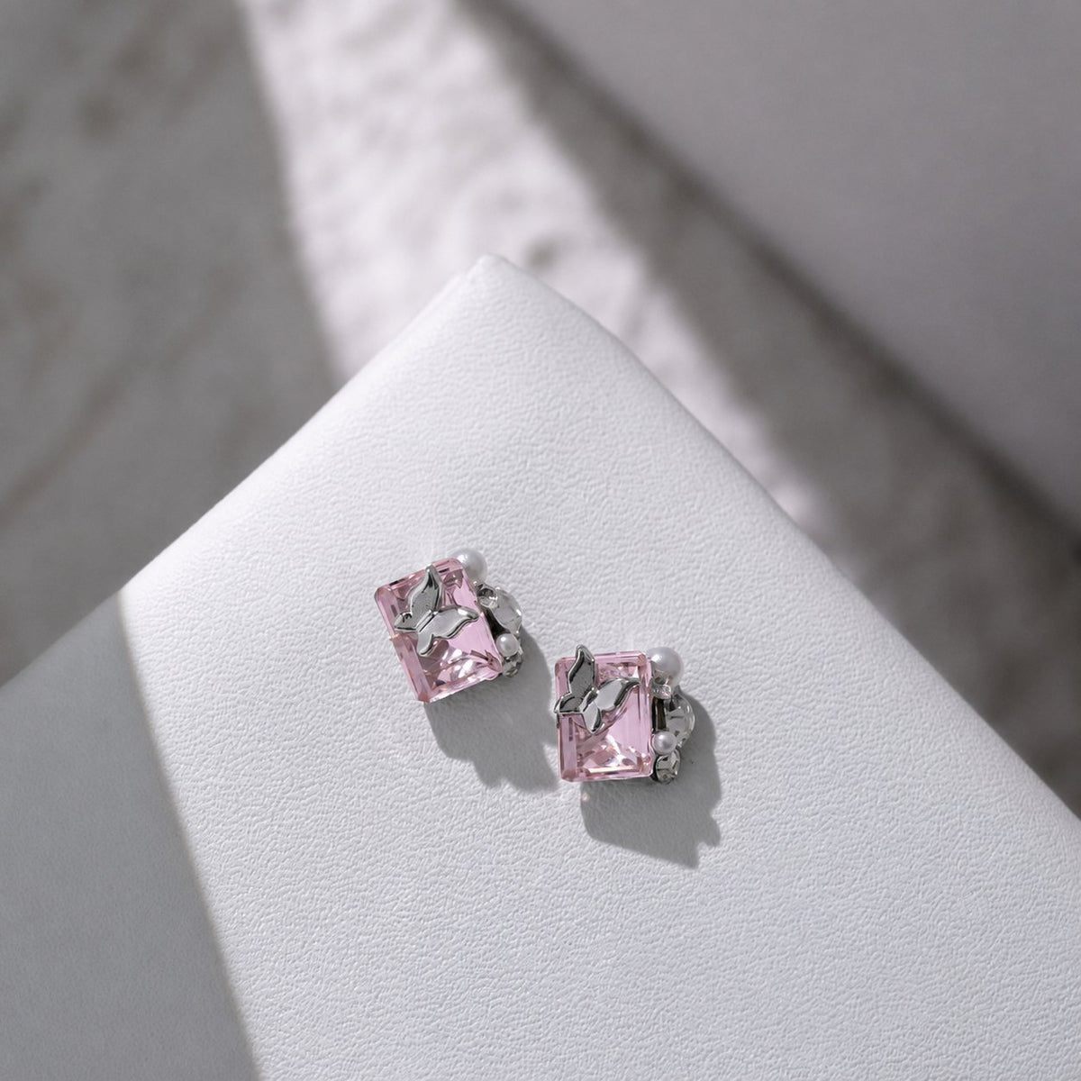 Pink rectangular butterfly nail charms with pearl accents