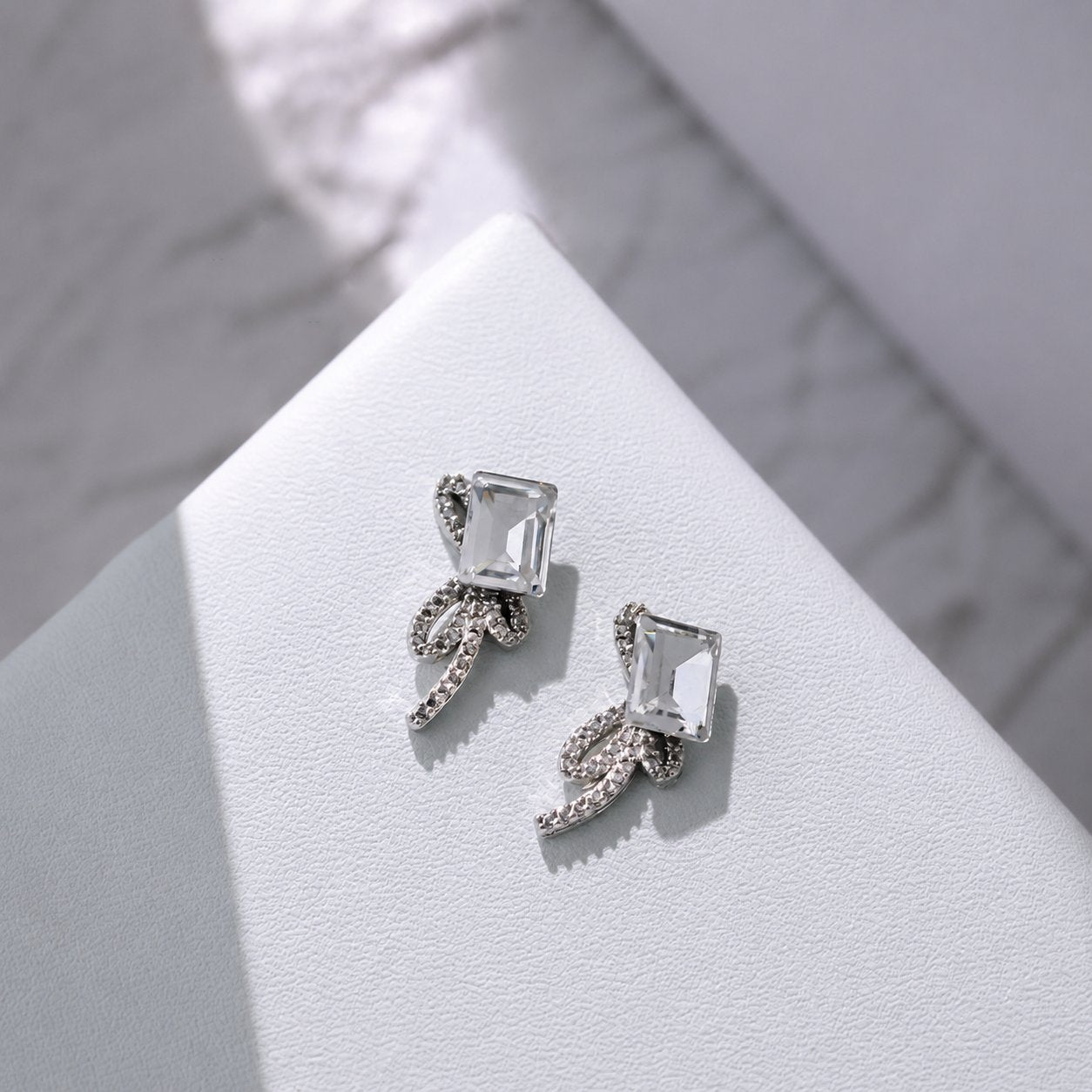 Clear rectangular crystal bow nail charms with silver accents
