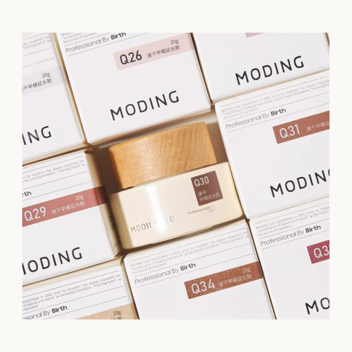 MODING builder gel Q-series packaging arranged neatly with Q30 jar centered among boxed units.