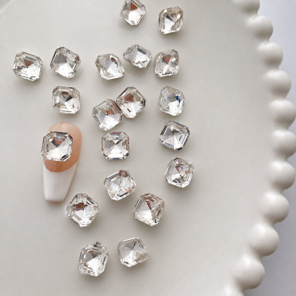 Clear 8 × 8 mm square octagon nail gem on a sample nail
