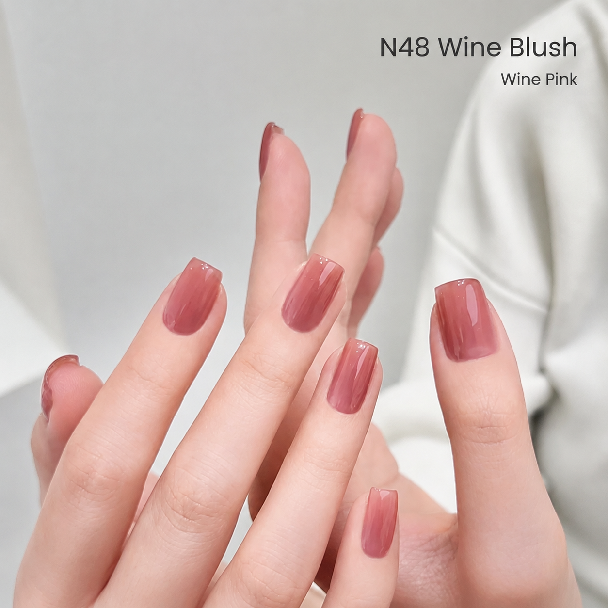 Wine-pink N48 gel nail color manicure on hands
