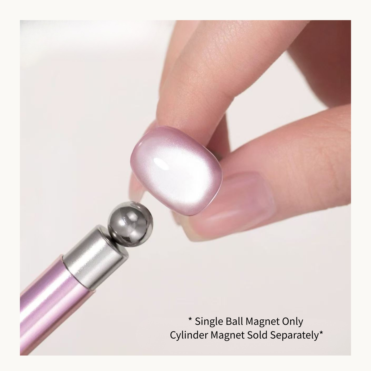 Steel ball magnet shaping a highlight on a pink nail swatch