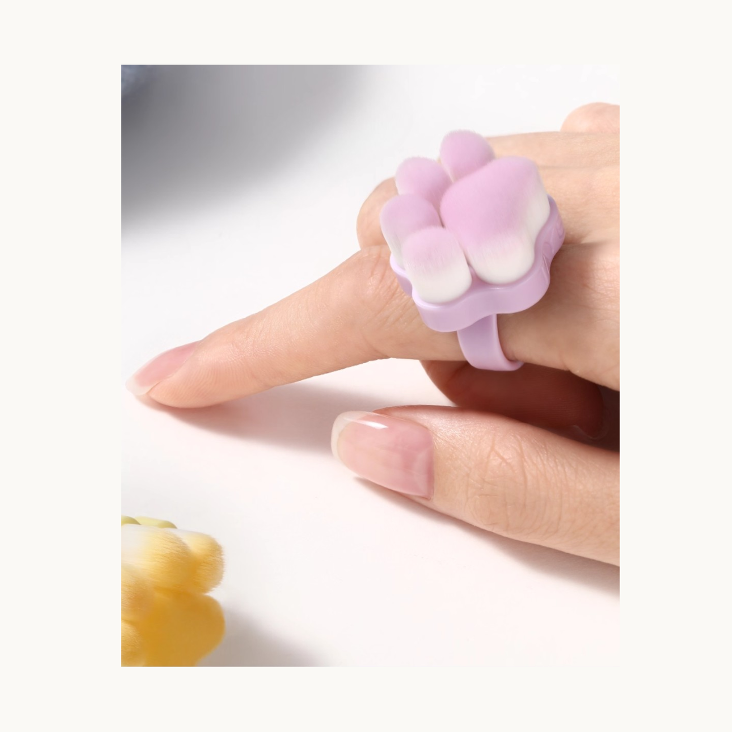 Meow Paw Brush worn on finger ring for hands-free nail cleaning