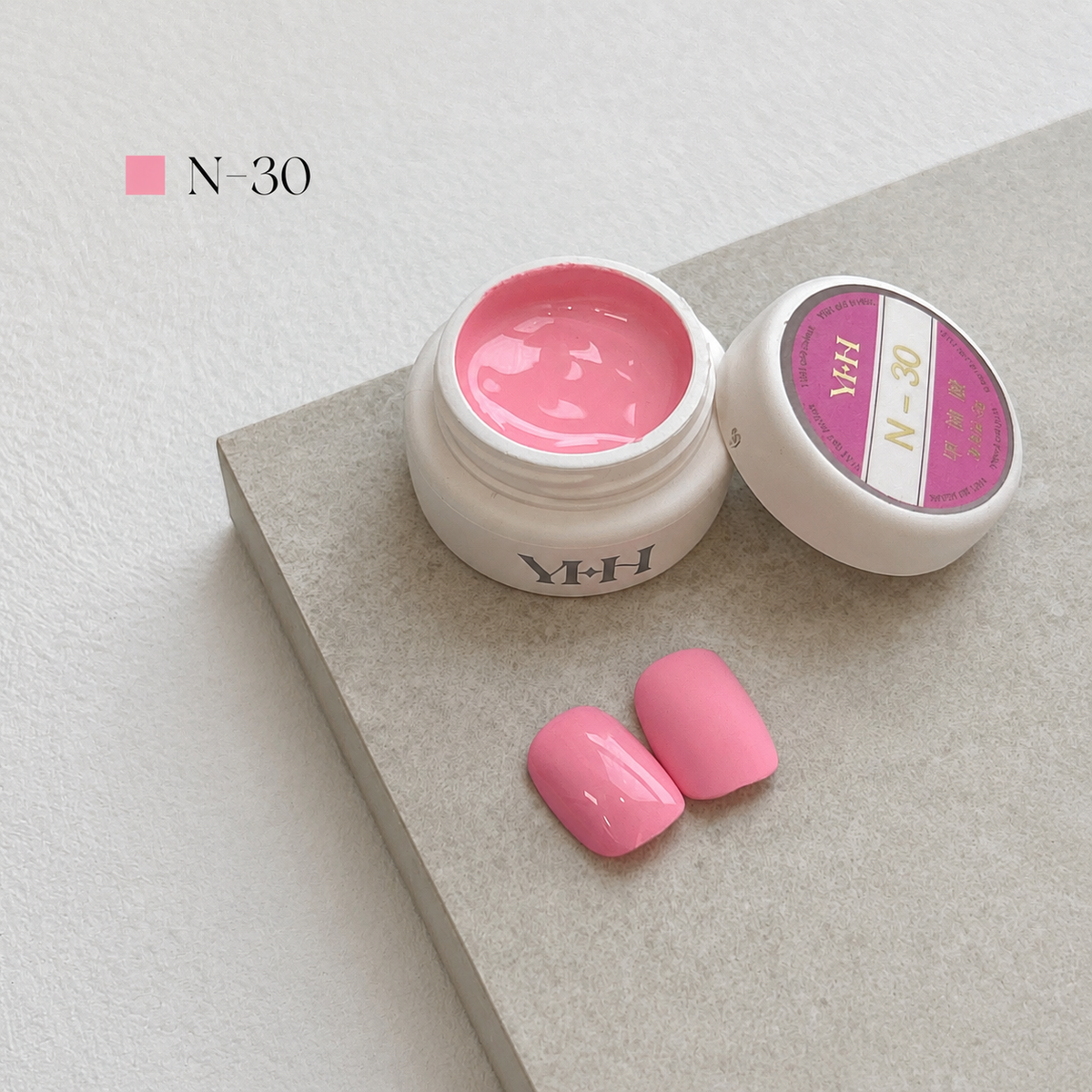 Soft pink nail color gel pot with glossy and matte swatches