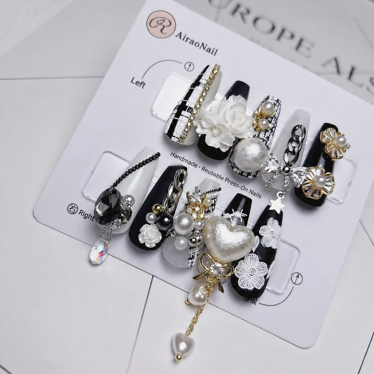 Close-up of 3D nail charms with pearl and rhinestone embellishments