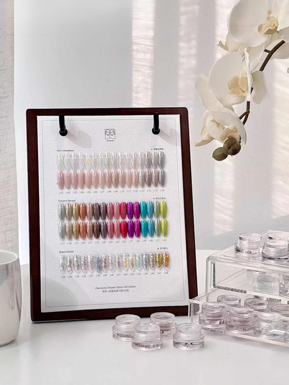 MODING Dreamlight Palette from NFormula Life, featuring 48 luminous glitter shades with opal, chrome, pearl, and aurora finishes for professional nail design.