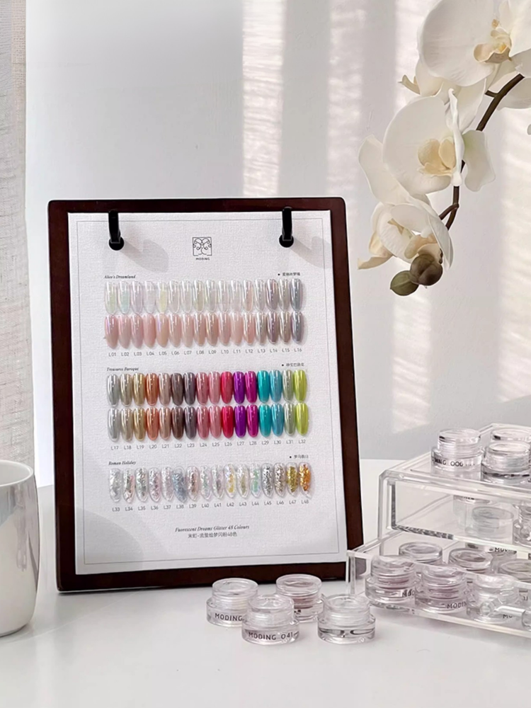 MODING Dreamlight Palette from NFormula Life, featuring 48 luminous glitter shades with opal, chrome, pearl, and aurora finishes for professional nail design.