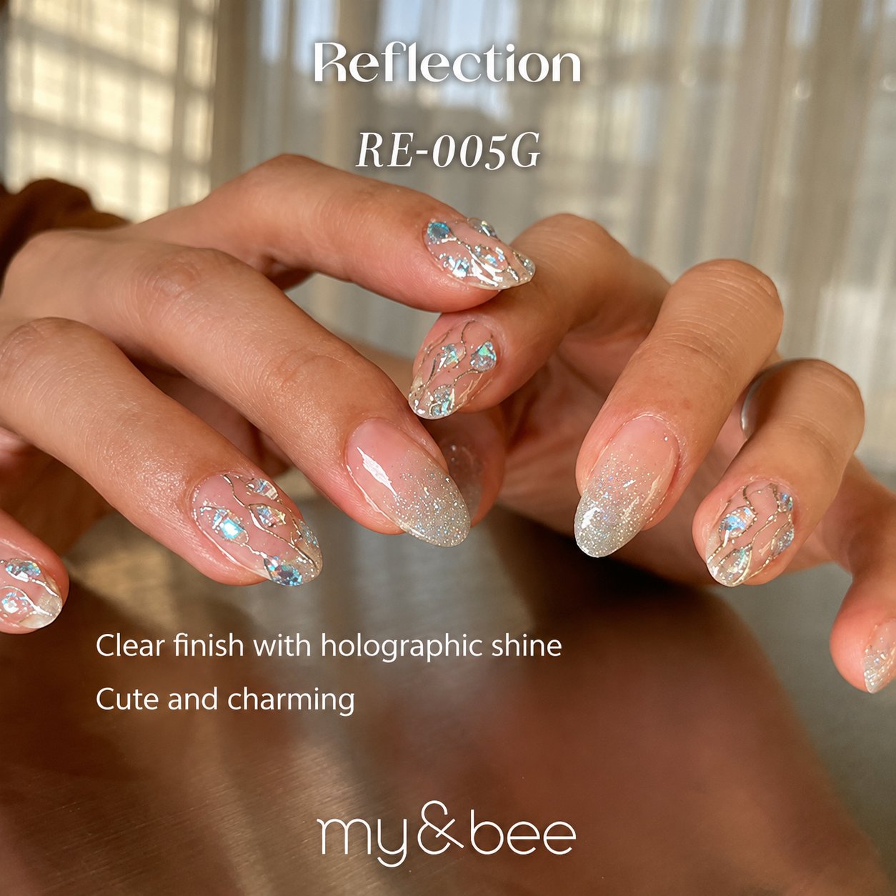 RE-005G clear glitter manicure with pale pink, gold, and blue flakes
