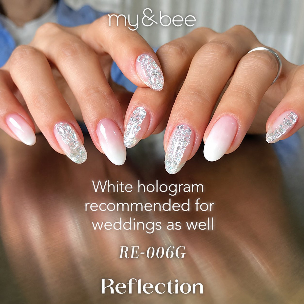 RE-006G white and silver glitter manicure on long almond nails