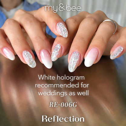 RE-006G white and silver glitter manicure on long almond nails