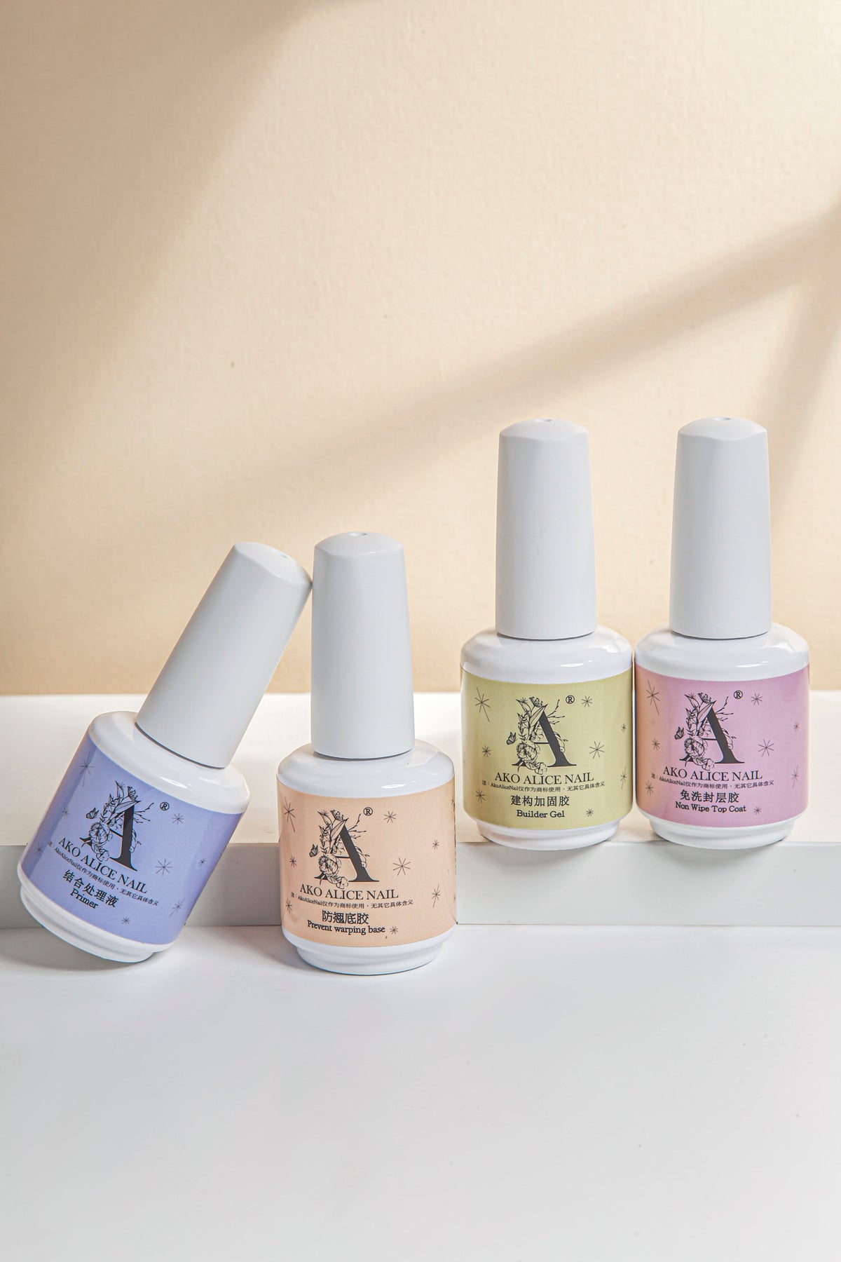 Nail function gel bottles in blue, peach, pale yellow, and pink