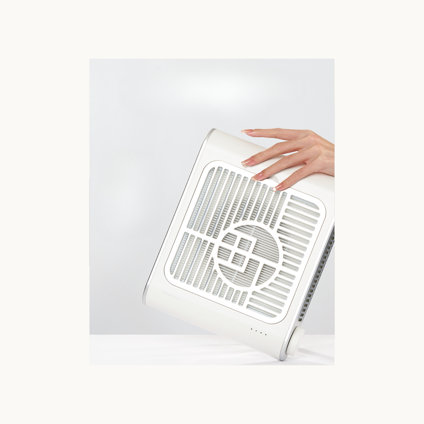 MODING nail dust collector being held by hand, showcasing portable lightweight design for professional salon use