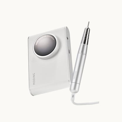 MODING D1 professional nail drill displayed in hand, showing portable body and premium aluminum handpiece