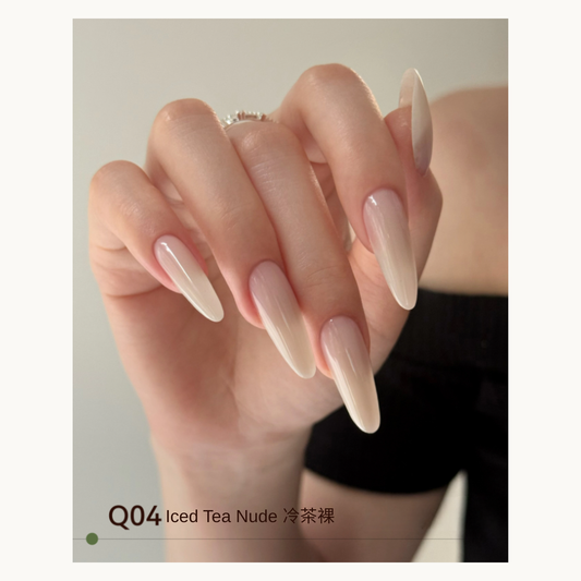 Q04 nude-to-ivory extension gel manicure on long almond nails