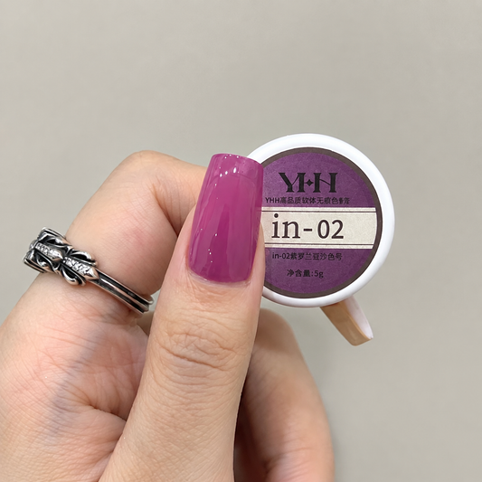 Pink nail color gel applied beside the in-02 gel pot