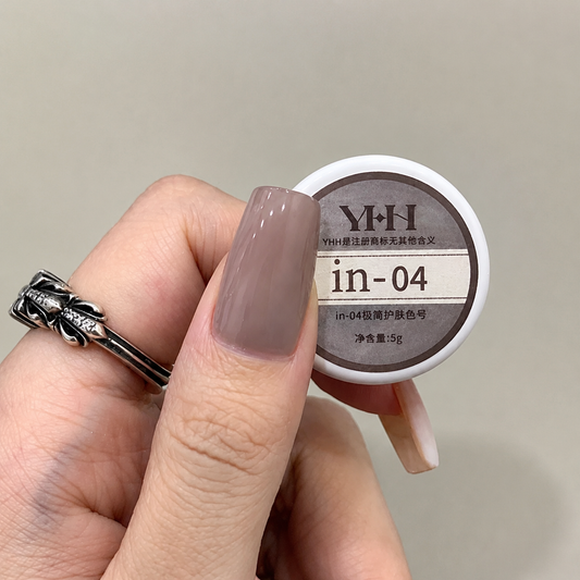 Muted mauve nail color gel applied beside the in-04 gel pot