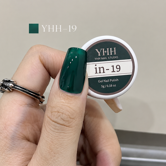 In-19 semi-transparent gel nail polish swatch in glossy deep teal green