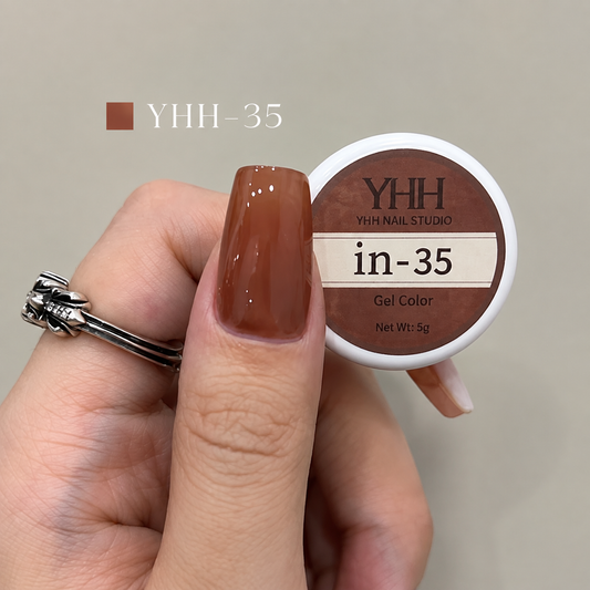 In-35 semi-transparent gel nail polish swatch in glossy warm terracotta brown