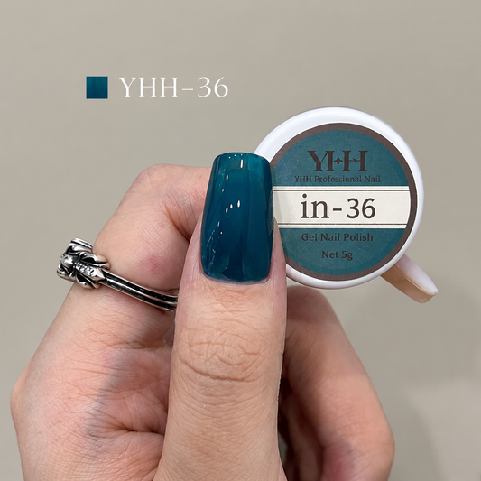In-36 semi-transparent gel nail polish swatch in glossy deep teal blue
