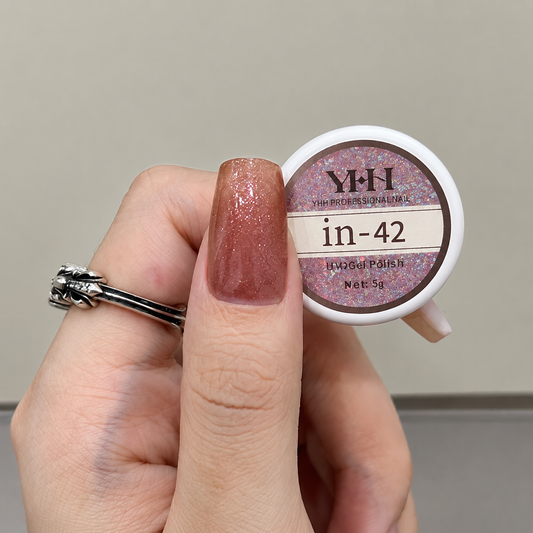 Mauve shimmery nail color gel sample on a painted nail