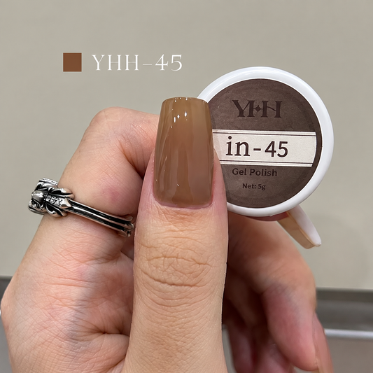 Warm brown nude nail color gel sample on a glossy painted nail