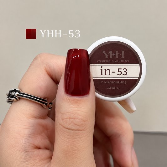 Bright red nail color gel sample on a glossy painted nail