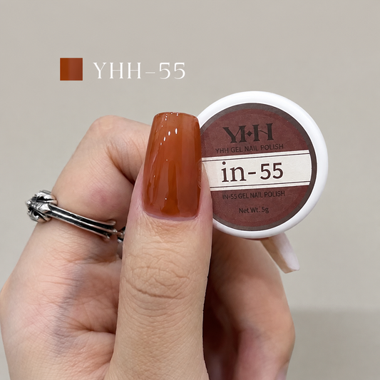 Orange brown nail color gel sample on a glossy painted nail