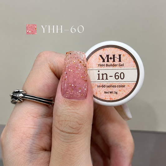 Translucent pink glitter nail color gel sample on a painted nail
