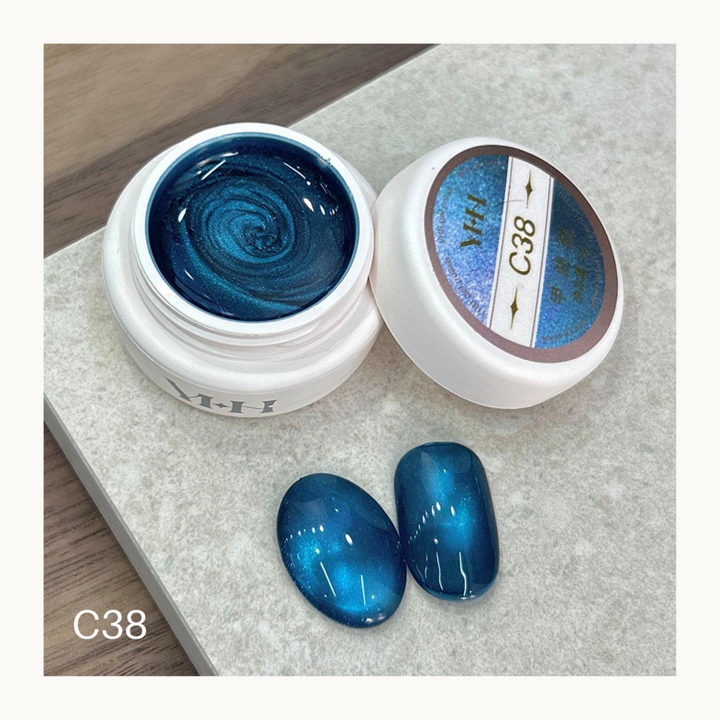 YHH C38 ocean teal cat eye gel with deep blue magnetic shimmer nail art swatch