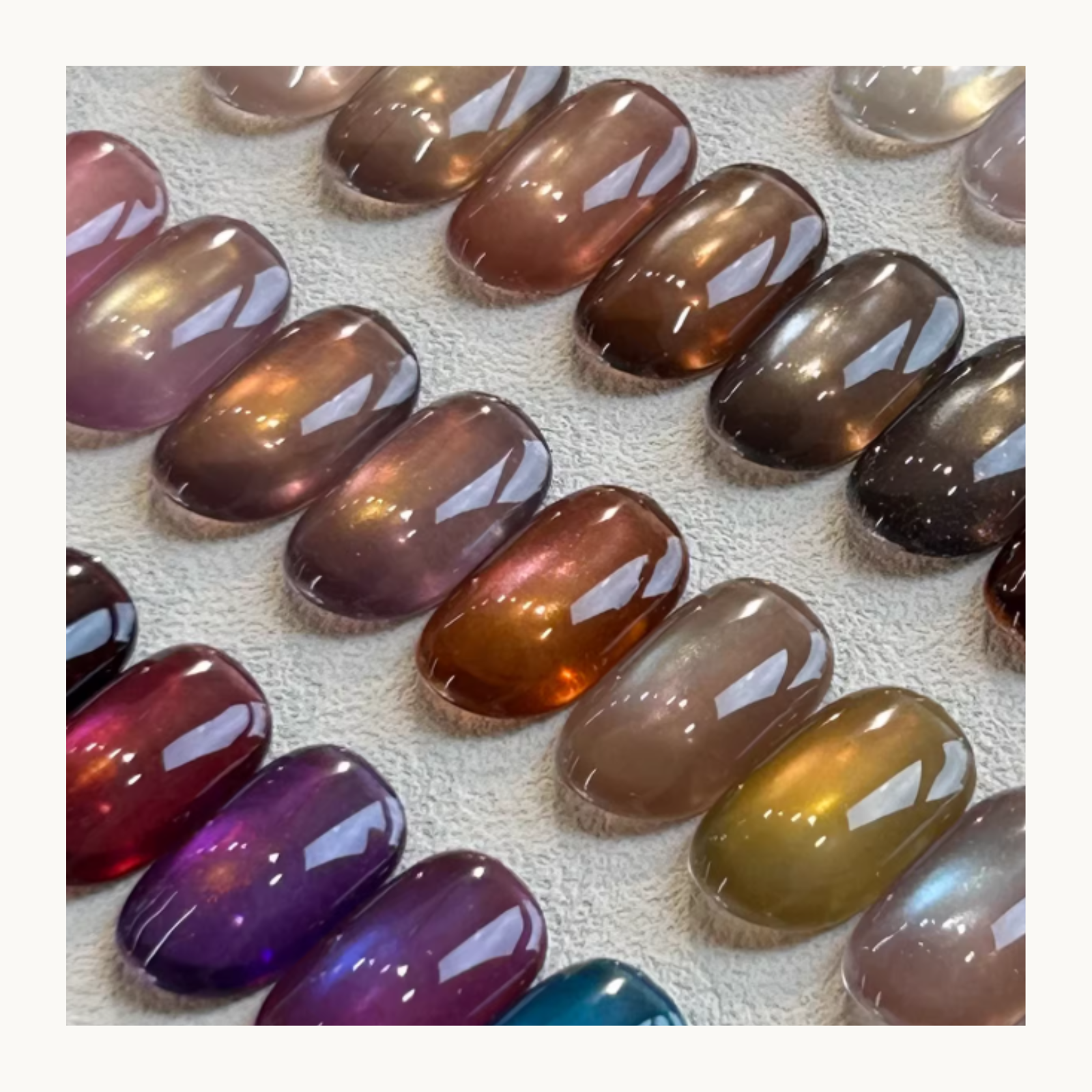 Close-up view of YHH cat eye gel nail swatches showing magnetic shimmer and translucent color shift effects