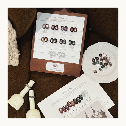 AndPretty Midnight Whisper cat eye gel collection displayed on wooden stand with all 10 magnetic shades