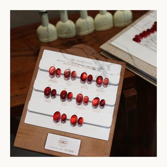 AndPretty Ruby Cat Eye Gel Collection color chart featuring 10 red magnetic gel shades with gemstone-inspired cat-eye glow.