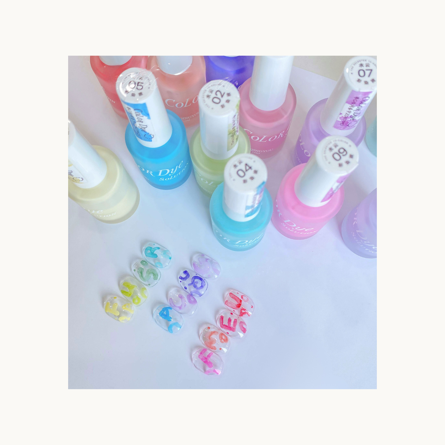 aqua and mint color dye gel bottles next to 12 pastel watercolor nail ink nail art samples