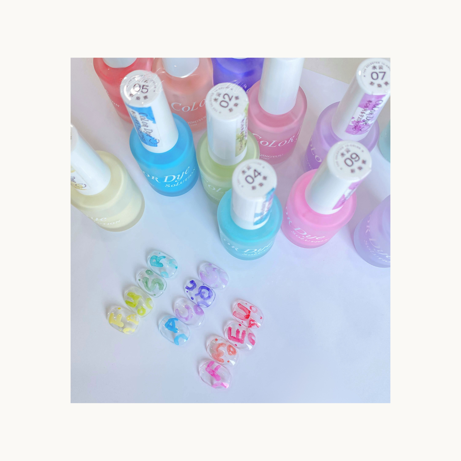 aqua and mint color dye gel bottles next to 12 pastel watercolor nail ink nail art samples