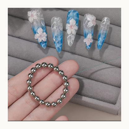 Cat eye gel nail design created with a round steel ball magnet ring, showing soft water ripple and flowing magnetic patterns
