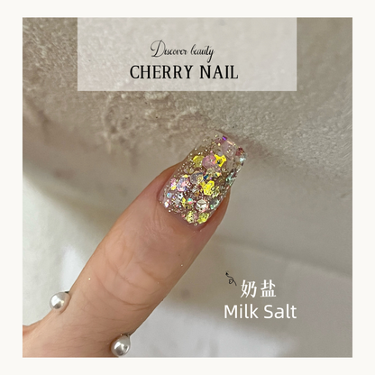 Cherry Nail Celestial Shards Milk Salt glitter featuring soft pastel iridescent crystal flakes layered over jelly gel nails for luminous nail art design
