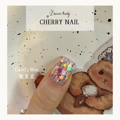 Cherry Nail Christmas Series Candy Box glitter nail design featuring colorful mixed chunky glitter flakes creating playful festive nail art styles
