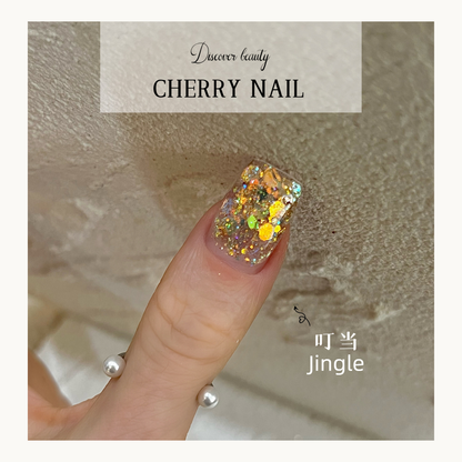 Cherry Nail Christmas Series Jingle glitter nail art featuring gold and iridescent chunky glitter flakes creating luxury Christmas nail decoration design
