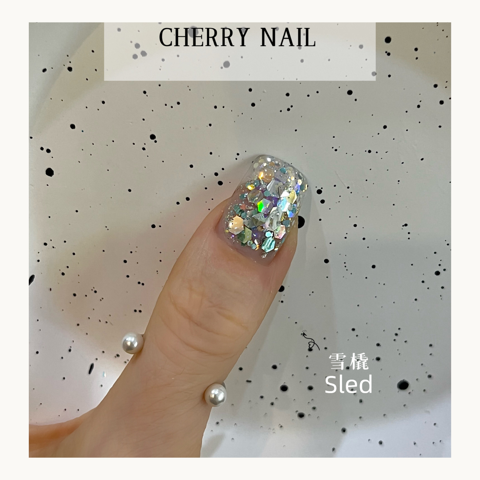 Cherry Nail Christmas Series Sled glitter nail art featuring silver and iridescent chunky glitter flakes creating winter inspired holiday nail decoration
