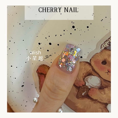 Cherry Nail Christmas Series Wish glitter nail design featuring holographic chunky glitter flakes layered on gel nails creating festive holiday nail art inspiration

