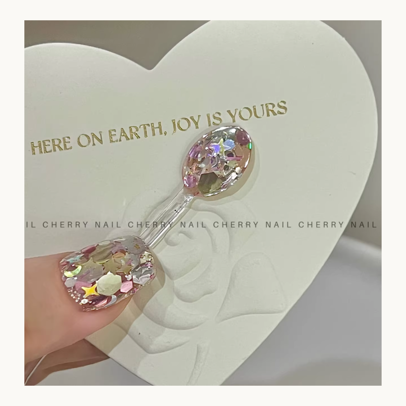 Cherry Nail Little Lollipop mixed glitter nail art with iridescent flakes and star shapes in clear gel design