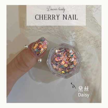Daisy glitter mix in a clear pot and applied on a thumb nail, showcasing its multidimensional reflective properties.