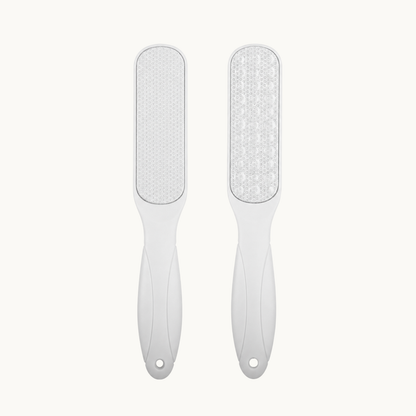 Two white dual-surface foot files shown upright with textured abrasive pads