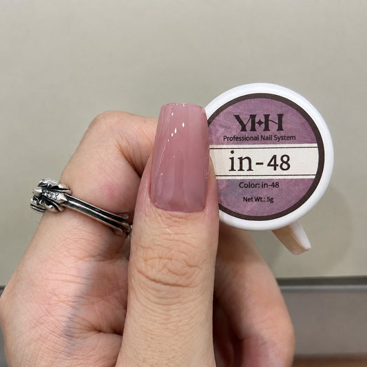 Sheer pale pink nail color gel sample on a glossy painted nail