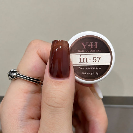 Dark brown nail color gel sample on a glossy painted nail