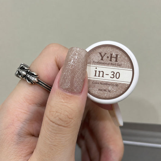 In-30 semi-transparent gel nail polish swatch in dense rose gold glitter