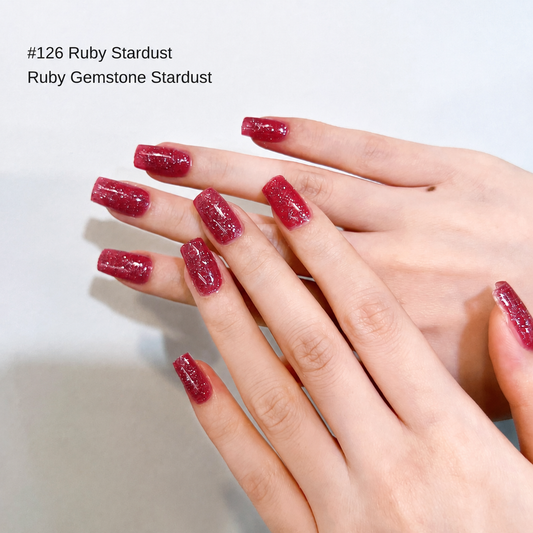 Deep ruby-red glitter nail color gel manicure displayed on two hands