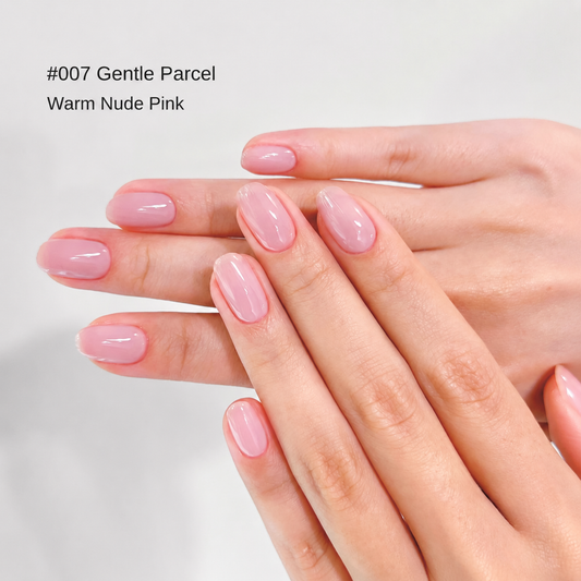 Gentle Parcel soft pink glossy nail color gel manicure on overlapping hands